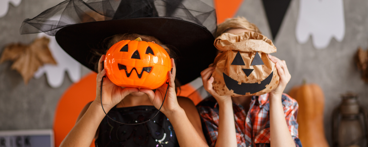 Children holding pumpkins