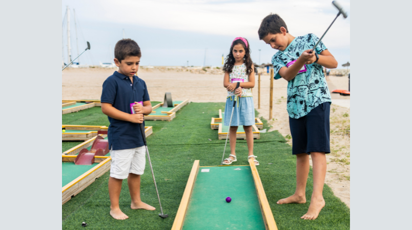 Children playing mini golf