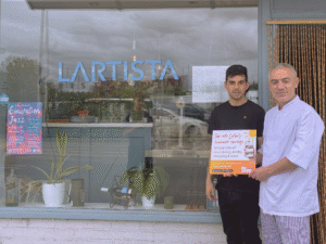 Staff from Lartista promoting the app deals